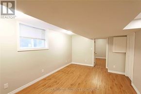 Barrie (Cundles East) apartment for rent - A room with wooden flooring and white walls, with a window on the left wall.