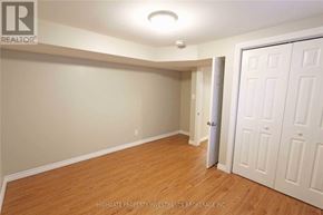 Barrie (Cundles East) apartment for rent - A room with wooden floors and white walls, with a door on the right side.