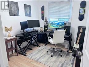 Barrie (Sunnidale) apartment for rent - A room with a desk, chair, and two monitors.