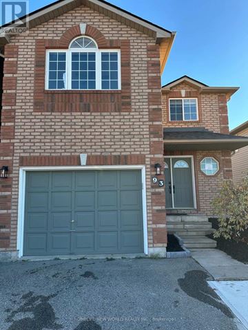 Barrie (Painswick South) apartment for rent - A house with a brick facade and a grey garage door.
