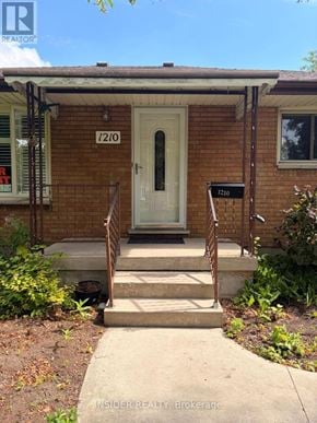 London East (East D) apartment for rent - A house with the number 1210 on the front door.
