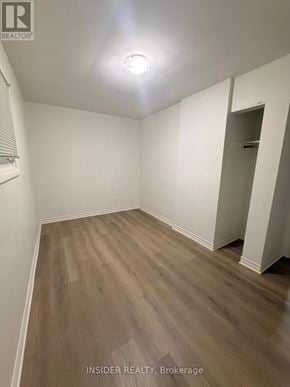 London East (East D) apartment for rent - A room with wooden flooring and white walls.