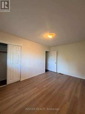 London East (East D) apartment for rent - A room with wooden flooring and two doors.