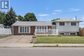 Hamilton (Kentley) apartment for rent - A house with a white fence is for sale.