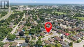Hamilton (Kentley) apartment for rent - An aerial view of a residential area with a red pin marking a specific location.
