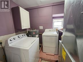 Bradford West Gwillimbury (Bradford) apartment for rent - A white washing machine and dryer in a small room.