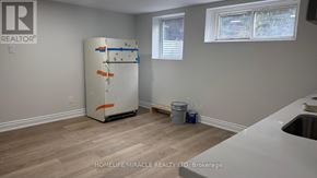 Toronto (Cliffcrest) apartment for rent - A room with a white refrigerator and a window.