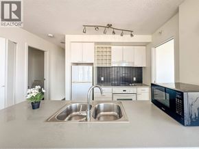 Vancouver apartment for rent - A kitchen with a sink and a microwave.
