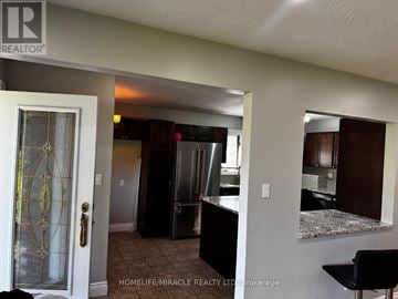 Oshawa (Donevan) apartment for rent - A realtor photo of a kitchen and living room.