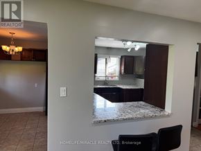 Oshawa (Donevan) apartment for rent - A realtor photo of a kitchen with a granite countertop.