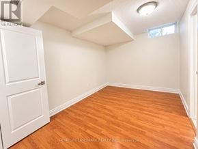 Markham (Cedarwood) apartment for rent - A room with wooden flooring and white walls.
