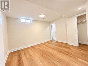 Markham (Cedarwood) apartment for rent - A room with wooden floors and white walls, with a window on the left wall.