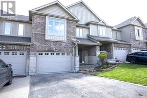 Waterloo townhouse for rent - A grey house with a white garage door.