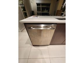 Vancouver apartment for rent - A white countertop with a stainless steel dishwasher underneath it.