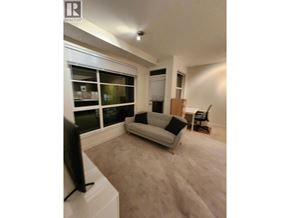 Vancouver apartment for rent - A living room with a couch, television, and a window.