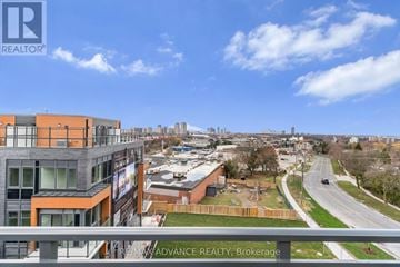 Toronto (Parkwoods-Donalda) townhouse for rent - A view of a city from a high vantage point with buildings and roads.