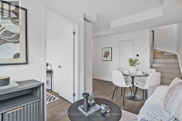 Toronto (Parkwoods-Donalda) townhouse for rent - A living room with a dining table and chairs.