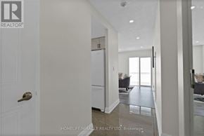 Mississauga (City Centre) condo for rent - A white door with a brass handle is on the left side of the image.