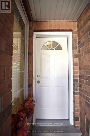 Guelph (Kortright East) townhouse for rent - A white door with a glass window above it.