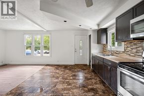 Windsor apartment for rent - A kitchen with a brown floor and a white ceiling.