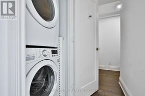 Toronto (Annex) condo for rent - A white washer and dryer in a small room.