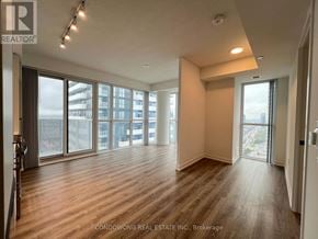 Vaughan (Vaughan Corporate Centre) condo for rent - A spacious room with wood flooring and large windows.