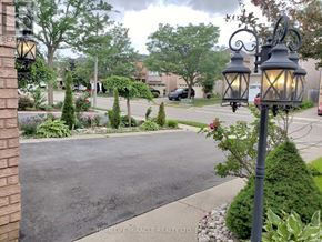 Brampton (Snelgrove) apartment for rent - A street view with a sign for HomeLife/Miracle Realty.