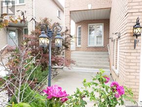 Brampton (Snelgrove) apartment for rent - A house with a front yard and a lamp post.