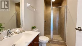 Mississauga (City Centre) condo for rent - A bathroom with a sink, toilet, and shower.