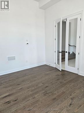 Oro-Medonte apartment for rent - A room with a wooden floor and a white door.