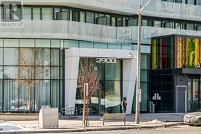 Mississauga (City Centre) condo for rent - A modern building with the number 3900 on it.