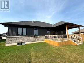Huron-Kinloss apartment for rent - A house with a stone foundation and a wooden deck.