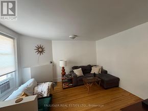 Ottawa apartment for rent - A living room with a couch, a chair, and a coffee table.