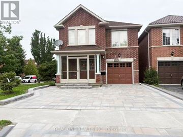 Toronto (Agincourt North) apartment for rent - A brick house with a garage door is for sale.