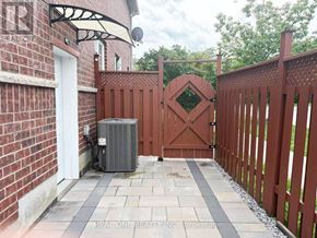 Toronto (Agincourt North) apartment for rent - A red gate with a diamond pattern in the middle is closed.
