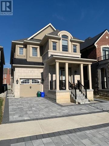 Vaughan (Kleinburg) apartment for rent - A two-story house with a garage and a brick wall.