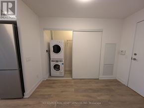Toronto (Don Valley Village) condo for rent - A small room with a washer and dryer stacked on top of each other.