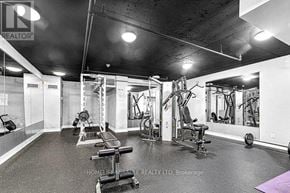 Toronto (Malvern) condo for rent - A gym with a variety of equipment including weights and machines.