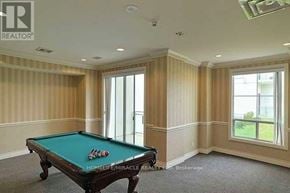 Toronto (Malvern) condo for rent - A pool table in a room with a window.