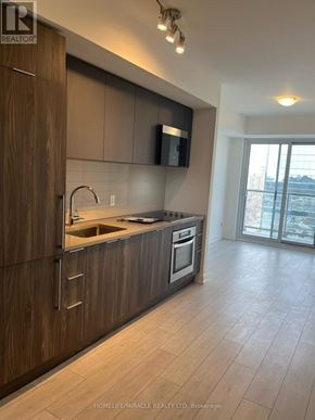 Toronto (Agincourt South-Malvern West) condo for rent - A kitchen with wooden cabinets and a stainless steel oven.