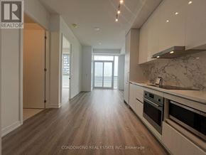 Vaughan (Concord) condo for rent - A kitchen with a marble countertop and stainless steel appliances.