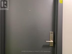 Mississauga (Cooksville) condo for rent - A door with a handle and a number 1603 on it.