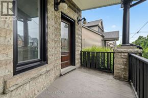 Hamilton (Kirkendall) apartment for rent - A house with a brown door and a stone wall.