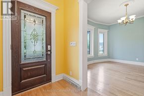 Hamilton (Kirkendall) apartment for rent - A room with a wooden door and a chandelier.