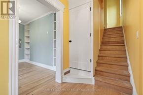 Hamilton (Kirkendall) apartment for rent - A hallway with a staircase leading to the second floor.
