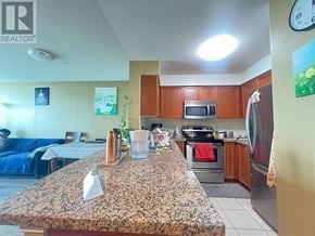 Mississauga (Central Erin Mills) condo for rent - A kitchen with granite countertops and stainless steel appliances.