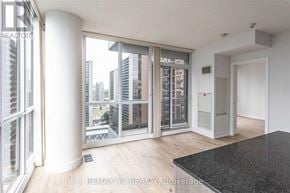 Toronto (Willowdale East) condo for rent - A room with a view of the city through large windows.