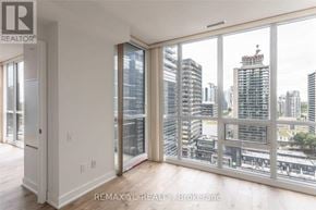 Toronto (Willowdale East) condo for rent - A room with a view of the cityscape through large windows.