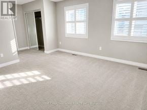 Cambridge apartment for rent - A room with a carpeted floor and a doorway leading to another room.