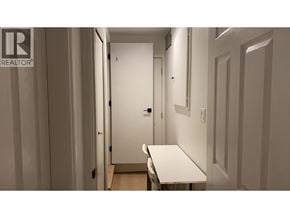 Vancouver apartment for rent - A white table is in the middle of a hallway.